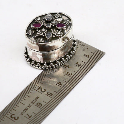 Sterling silver handcrafted oval trinket box with red stone accents, ideal for jewelry, kajal, or sindur storage, bridal gift.