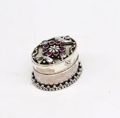 Handcrafted 925 sterling silver oval-shaped trinket box with stone work, ideal for jewelry, kajal eyeliner, or Sindur, by TRIBAL ORNAMENTS.