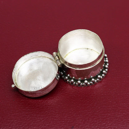 Handcrafted 925 silver round trinket box with red stone design, ideal for jewelry, kajal, or sindur storage, by Tribal Ornaments.