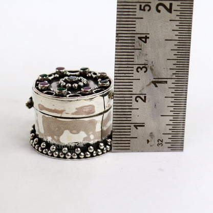 Handcrafted 925 silver round trinket box with red stone accents, ideal for jewelry, kajal, or sindur storage, by TRIBAL ORNAMENTS.