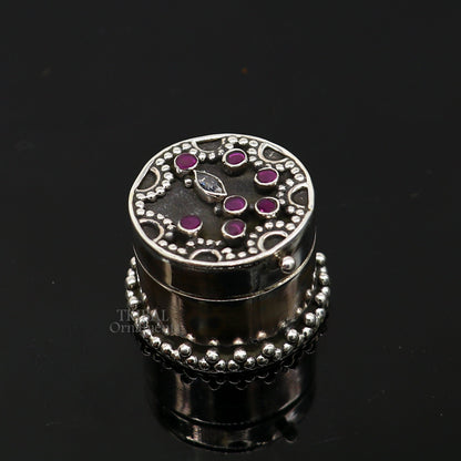 Handcrafted 925 sterling silver round trinket box with red stone accents, ideal for jewelry, kajal, or sindur storage by Tribal Ornaments.