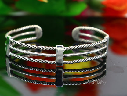 Handcrafted vintage style 925 sterling silver bangle cuff bracelet by TRIBAL ORNAMENTS, featuring intricate design and adjustable fit.