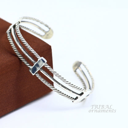Vintage style 925 sterling silver handcrafted bangle cuff bracelet with intricate tribal design, adjustable for men and women.