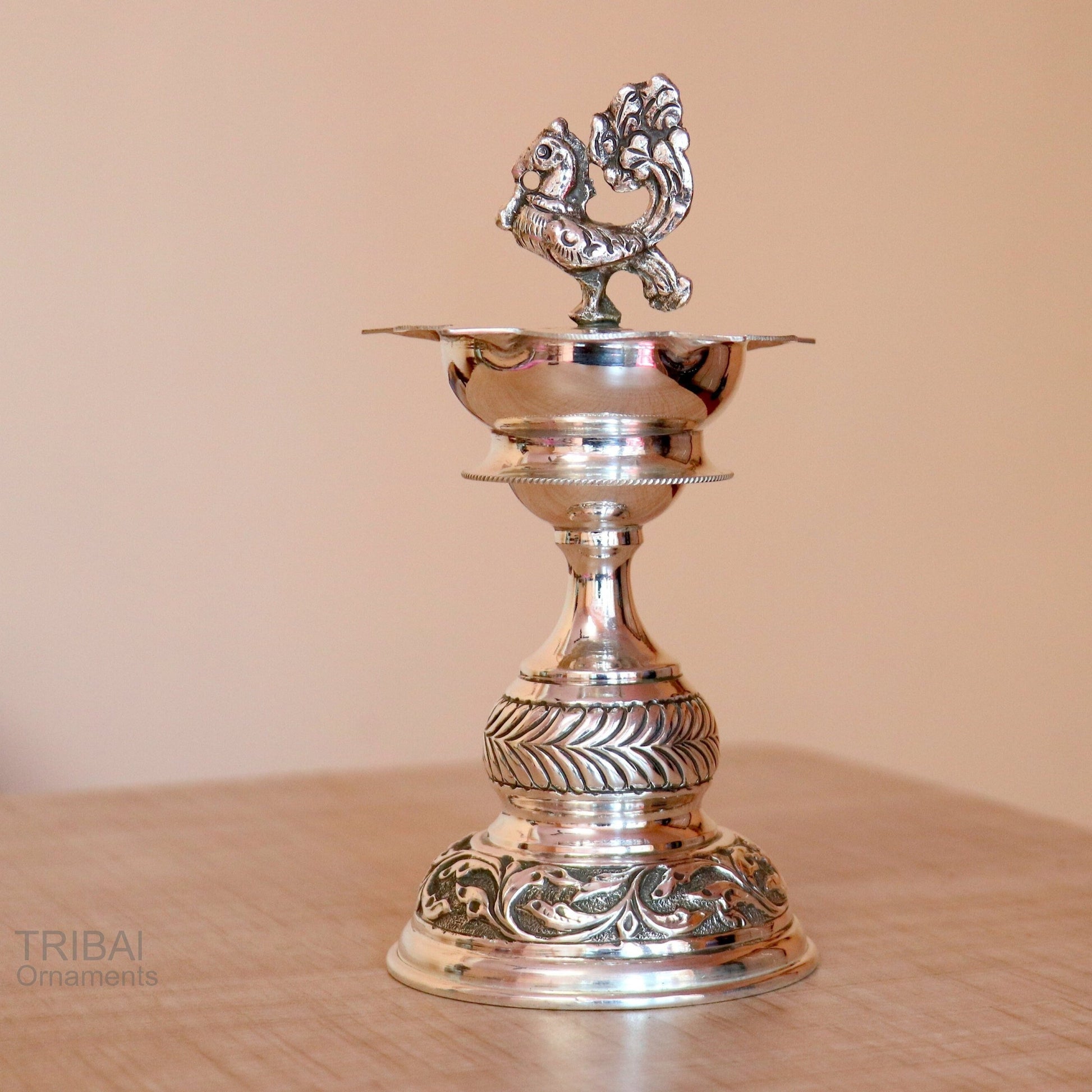 Handcrafted 925 sterling silver vintage oil lamp or candle stand, decorative Deepak for puja, with silver figurine and utensils.
