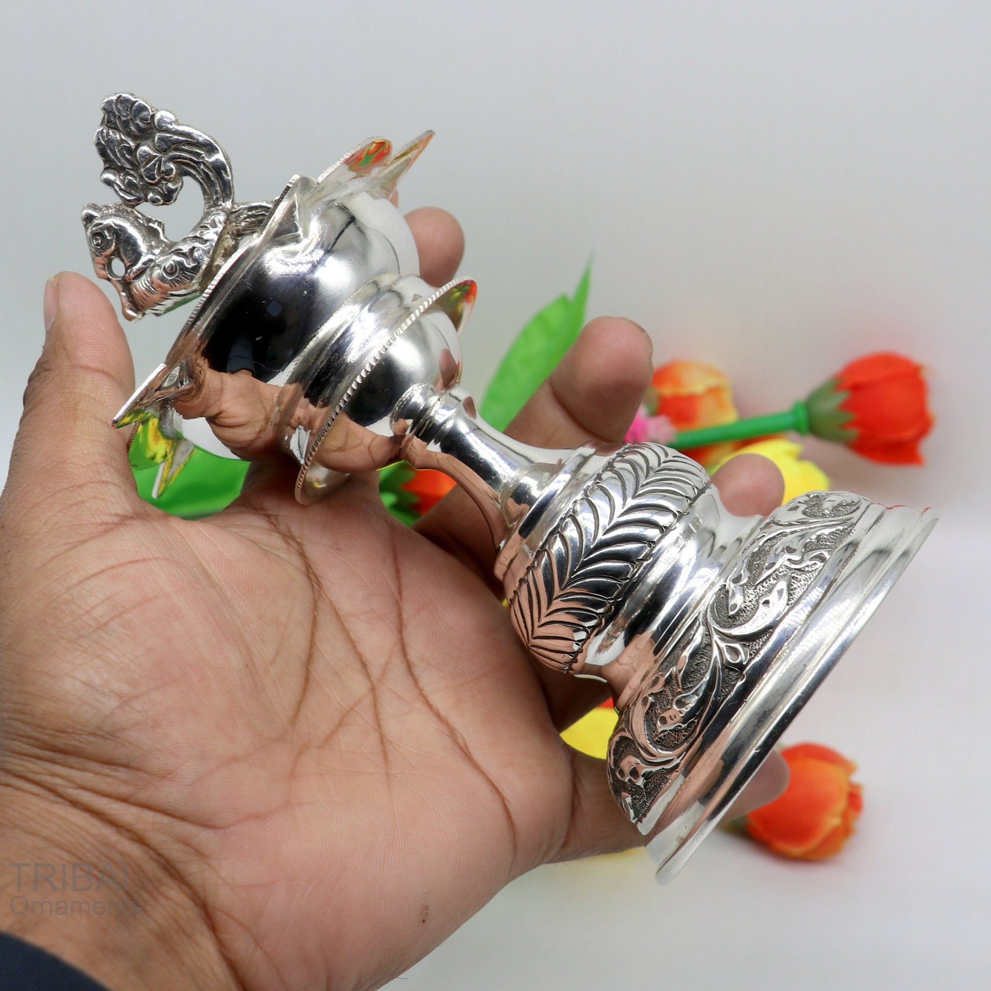Sterling silver vintage oil lamp or candle stand with handcrafted design, ideal for puja, featuring silver Deepak and figurine.