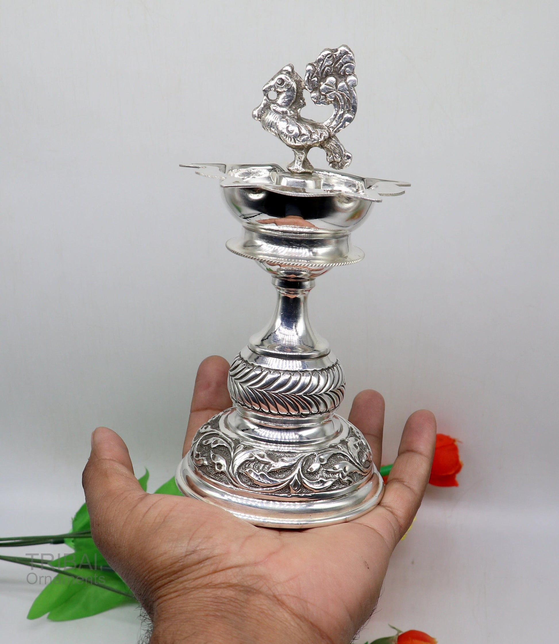 Handcrafted 925 sterling silver vintage oil lamp or candle stand with intricate detailing, used as puja utensil or decorative silver figure.