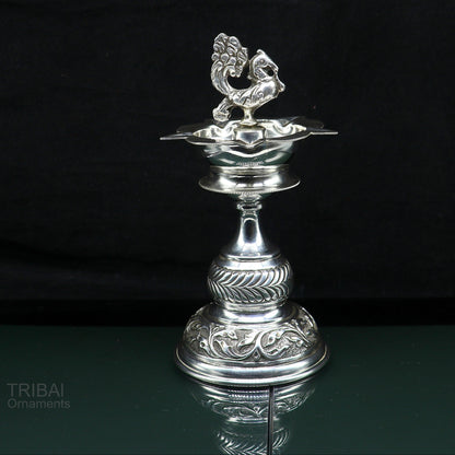 Handcrafted 925 sterling silver vintage oil lamp or candle stand with detailed silver Deepak for puja and religious ceremonies.