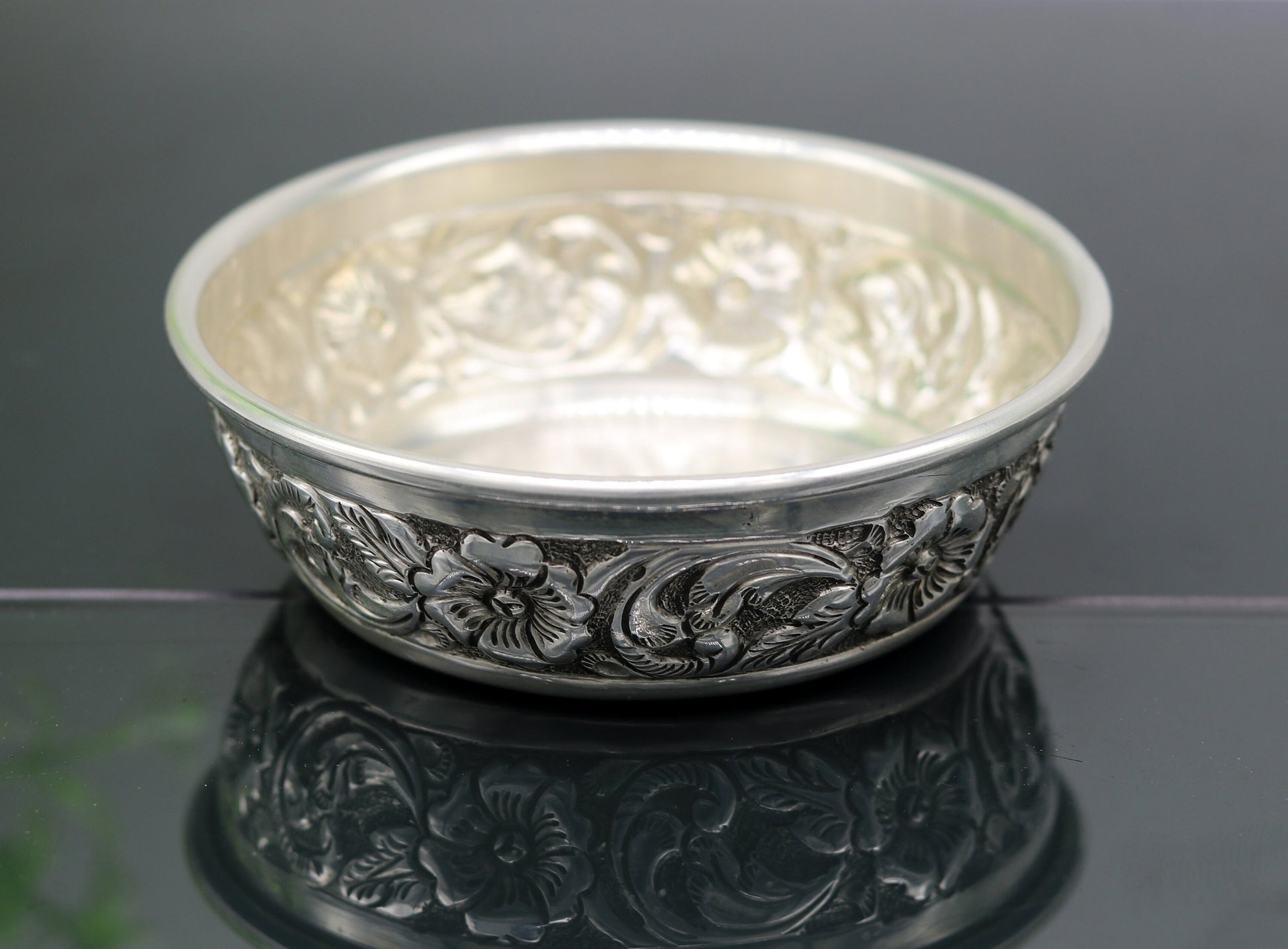 Handcrafted 925 sterling silver bowl and spoon by TRIBAL ORNAMENTS, featuring intricate designs, ideal for baby rice ceremony gifts.