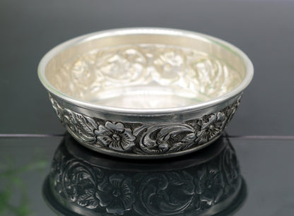 Handcrafted 925 sterling silver bowl and spoon by TRIBAL ORNAMENTS, featuring intricate designs, ideal for baby rice ceremony gifts.