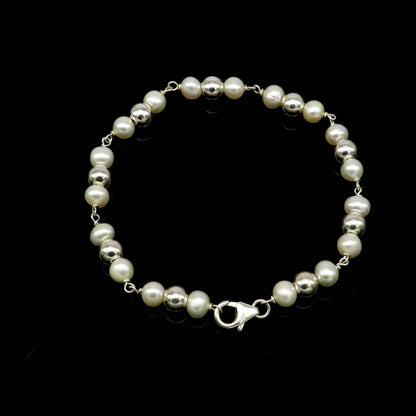 Sterling silver round beads and pearl bracelet by TRIBAL ORNAMENTS, stylish handmade beaded jewelry, 7.5 inches long.