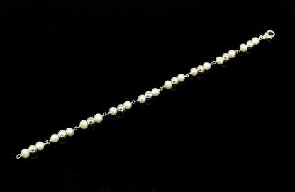 Sterling silver round bead pearl bracelet by TRIBAL ORNAMENTS featuring 5.5mm beads and a customized 7.5-inch length.