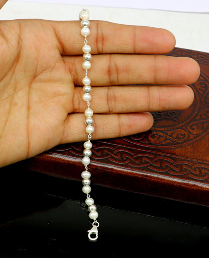 Sterling silver round bead and pearl bracelet by TRIBAL ORNAMENTS, handcrafted beaded jewelry, stylish 7.5-inch length.