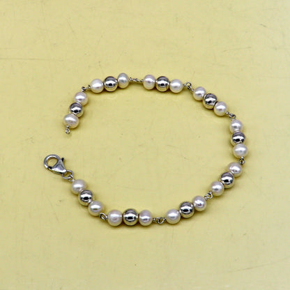 Sterling silver round beads and pearl bracelet by TRIBAL ORNAMENTS, handmade beaded jewelry, 7.5 inches long, stylish and customizable.