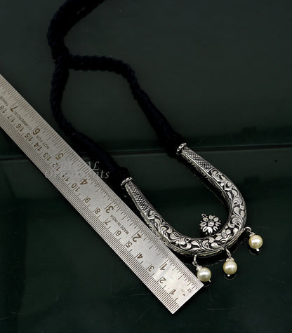 Sterling silver adjustable necklace by TRIBAL ORNAMENTS featuring traditional cultural design and delicate handcrafted jewelry style.