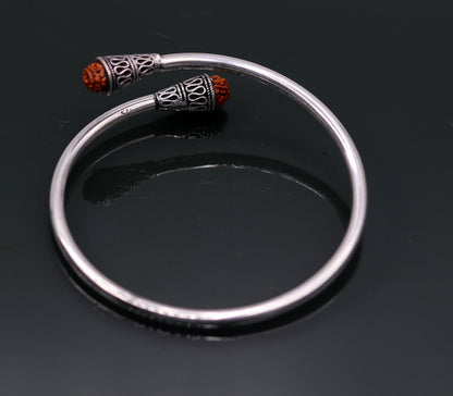 Unisex 925 sterling silver Rudraksha beads bangle cuff bracelet with adjustable fit, handcrafted tribal jewelry from India.