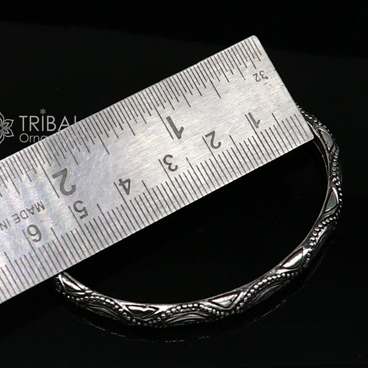 Sterling silver modern trendy cuff kada bracelet by TRIBAL ORNAMENTS, featuring sleek design, adjustable fit, for unisex jewelry.