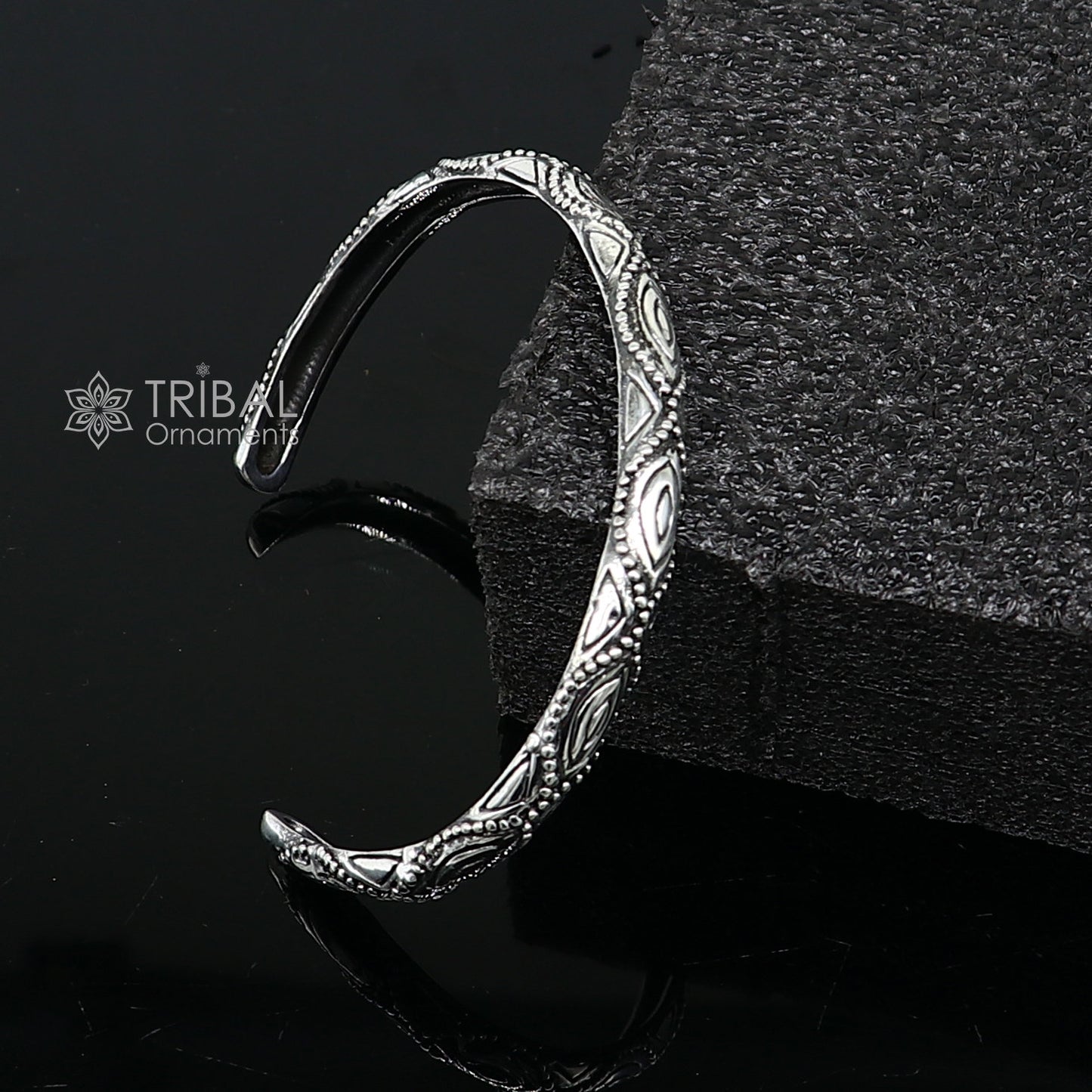 Sterling silver modern trendy cuff bracelet by Tribal Ornaments, adjustable unisex jewelry with intricate design and stylish finish.