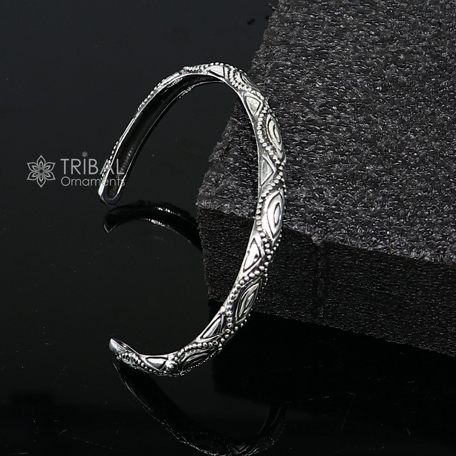 Sterling silver modern trendy cuff bracelet by Tribal Ornaments, adjustable unisex jewelry with intricate design and stylish finish.