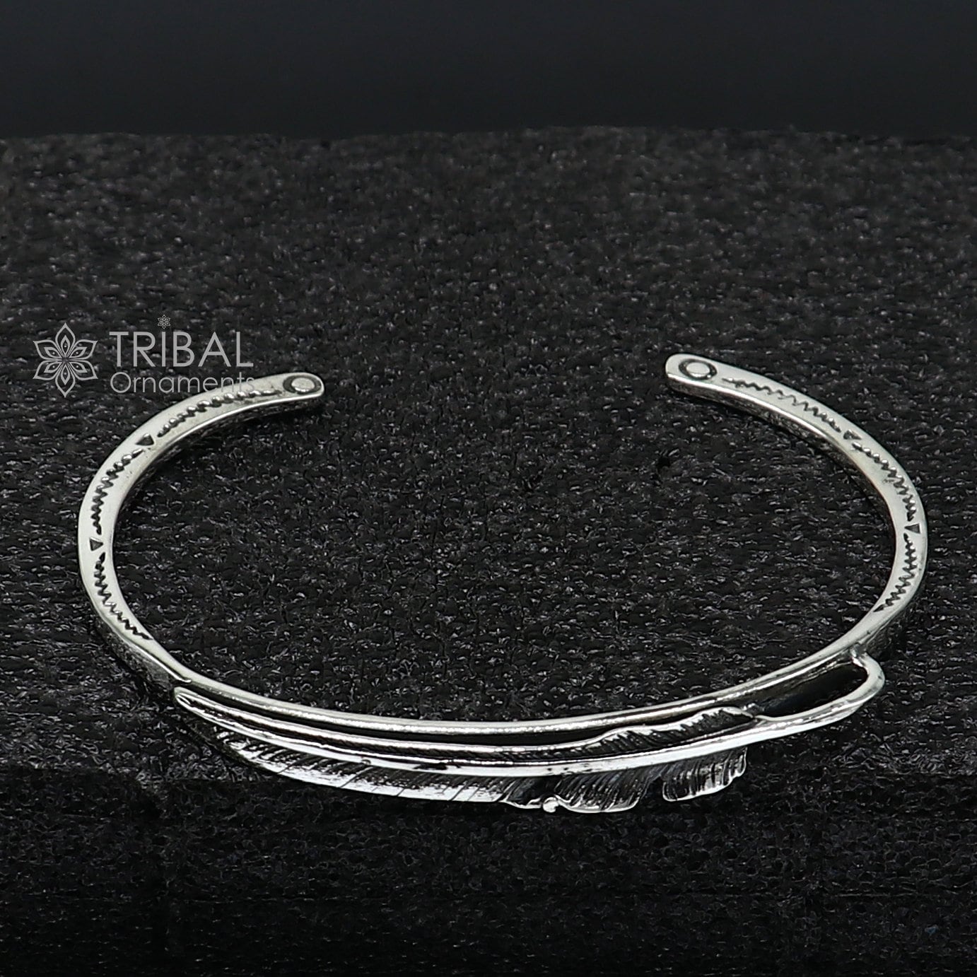Stylish 925 sterling silver feather design adjustable cuff bracelet by Tribal Ornaments, unisex jewelry with modern trendy style.