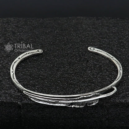 Stylish 925 sterling silver feather design adjustable cuff bracelet by Tribal Ornaments, unisex jewelry with modern trendy style.