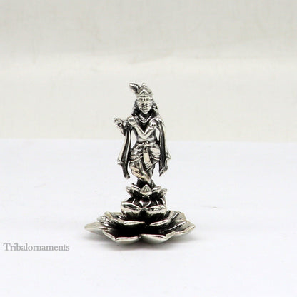 Sterling silver Lord Krishna idol with flute, handcrafted antique design, standing statue suitable for puja and decorative display.