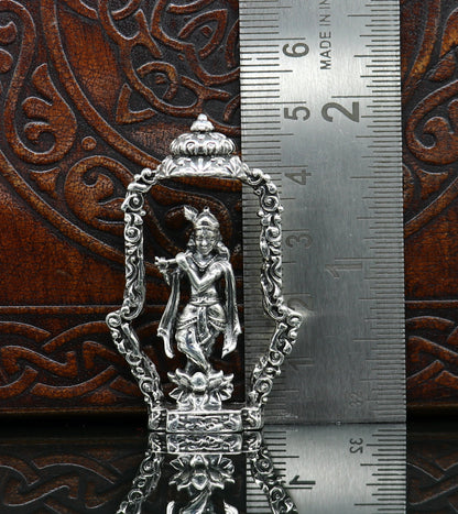 Sterling silver Lord Krishna idol with flute, handmade antique design, standing statue for puja and decorative display.