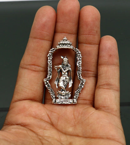 Sterling silver Lord Krishna idol with flute, handmade antique design, standing statue for puja and decorative gift display.