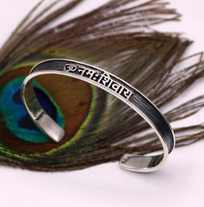Unisex 925 sterling silver OM Namah Shivay mantra bangle cuff bracelet with open face design, handmade Indian jewelry by Tribal Ornaments.