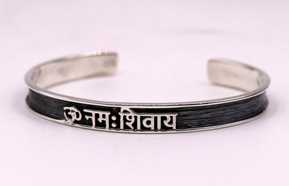 Unisex 925 sterling silver OM Namah Shivay mantra bangle cuff bracelet with open face design, handmade Indian jewelry from Tribal Ornaments.