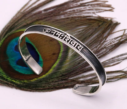 Unisex 925 sterling silver OM Namah Shivay mantra bangle cuff bracelet with open face design, handmade Indian tribal jewelry.