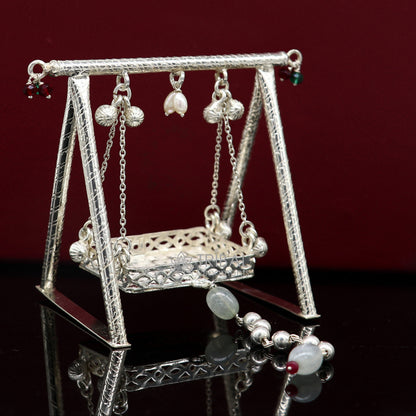 Sterling silver handmade Bal Gopala Krishna swing pendant, detailed child Krishna jhula art, intricate silver ornament.