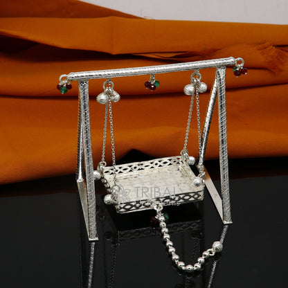 Handmade 925 sterling silver Bal Gopala jhula with Little Krishna swing, detailed silver art of Laddu Gopal for children.