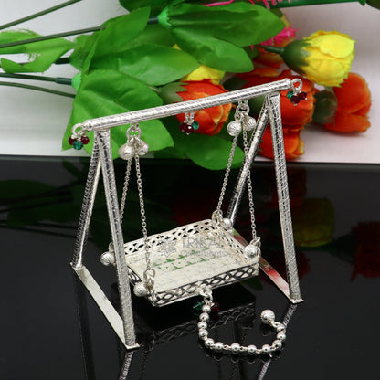 Handmade 925 sterling silver Bal Gopala swing depicting Little Krishna on a child-friendly Jhula, crafted by Tribal Ornaments.