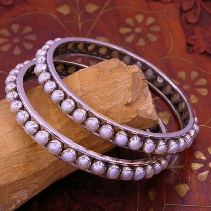 Sterling silver bangle bracelet with a natural pearl, tribal oxidized jewelry design, handmade by TRIBAL ORNAMENTS.