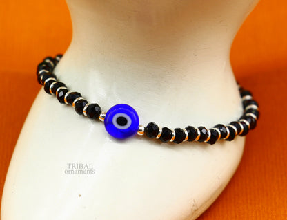 Sterling silver handmade evil eye beaded bracelet by TRIBAL ORNAMENTS, adjustable girl's jewelry with colorful beads and protective charm.
