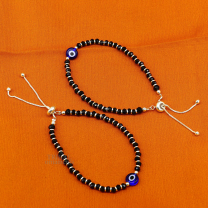 Sterling silver handmade evil eye beaded bracelet by TRIBAL ORNAMENTS, adjustable girl’s jewelry with colorful beads and evil eye charm.