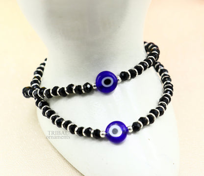 Sterling silver handmade evil eye beaded bracelet by TRIBAL ORNAMENTS, adjustable jewelry for girls and toddlers with colorful beads.