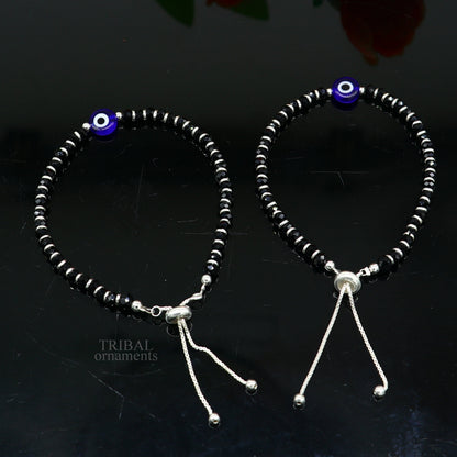 Sterling silver handmade evil eye beaded bracelet by TRIBAL ORNAMENTS, adjustable girl’s jewelry with colorful beads and protective eye charm.