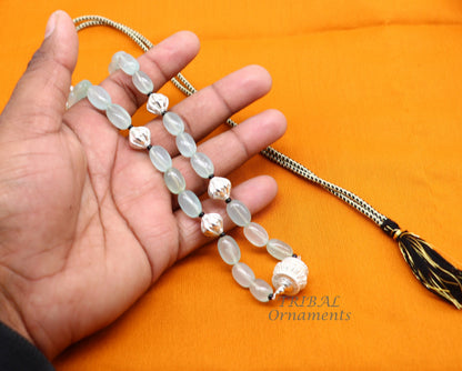 Sterling silver necklace with aqua quartz beads and silver accents, handmade tribal jewelry for elegant party wear.