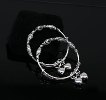 Sterling silver vintage baby bangles with adjustable charm design, handmade by Tribal Ornaments, perfect for newborn kids jewelry.