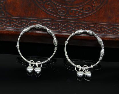 Sterling silver vintage design adjustable baby bangle with charms, handmade by TRIBAL ORNAMENTS for newborn kids jewelry.