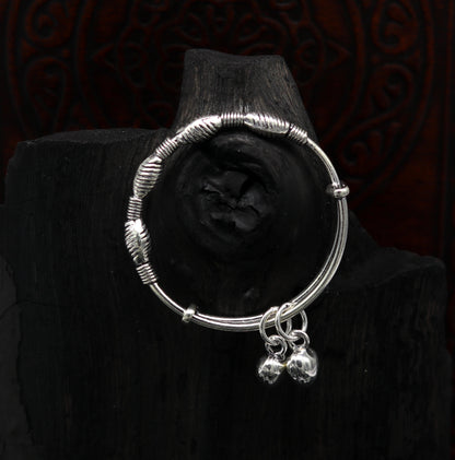 Sterling silver vintage-style adjustable baby bangle with beaded charm, handmade tribal design for newborns and kids jewelry.