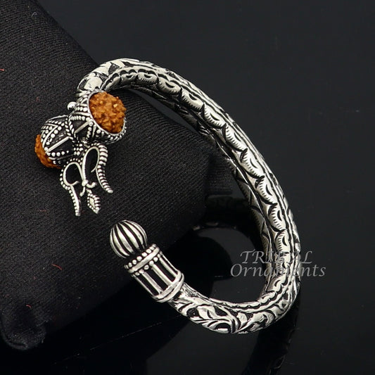 Sterling silver handmade Lord Shiva trident trishul bangle bracelet with Rudraksha beads, featuring Chitai work and customized design.