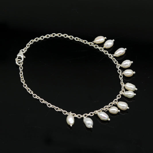 Sterling silver customized charm pearl bracelet by Tribal Ornaments, unisex jewelry with handmade design and stylish pearl accents.