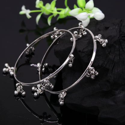 Sterling silver bridesmaid bangle bracelet with hanging bells, handcrafted and personalized by TRIBAL ORNAMENTS.