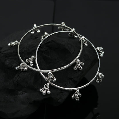 Sterling silver bridesmaid bangle bracelet with hanging bells, handmade and personalized by TRIBAL ORNAMENTS for wedding gifting.