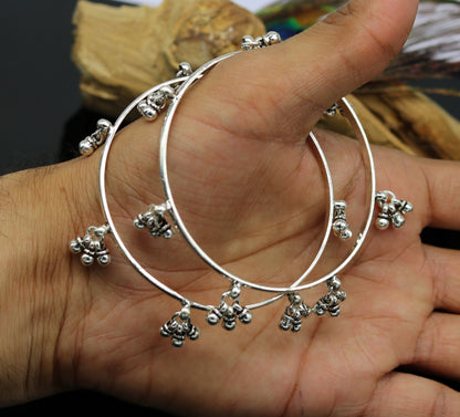 Sterling silver bridesmaid bangle bracelet with hanging bells, personalized and handmade by Tribal Ornaments, perfect for weddings.