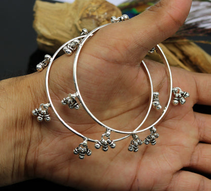 Sterling silver handmade bridesmaid bangle with hanging bells, personalized wedding bracelet by TRIBAL ORNAMENTS.