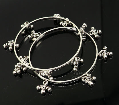 Sterling silver bridesmaid bangle bracelet with hanging bells, handcrafted by Tribal Ornaments, personalized wedding jewelry.