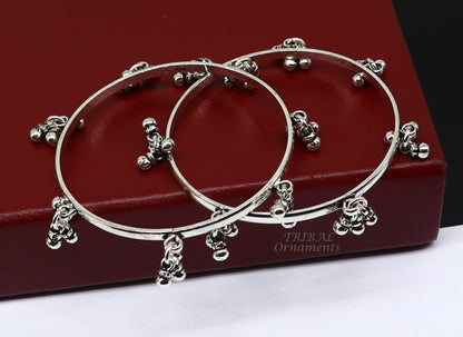 Sterling silver bridesmaid bangle bracelet with hanging bells from Tribal Ornaments, personalized wedding jewelry and gifting accessory.